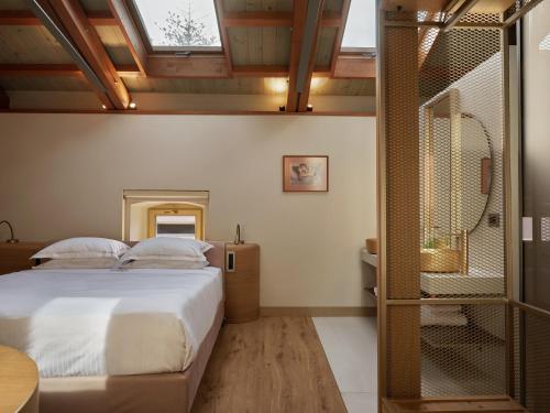 Postel nebo postele na pokoji v ubytování Domus Blanc Boutique Hotel