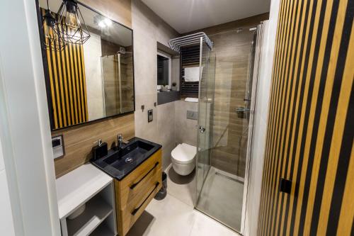 Kúpeľňa v ubytovaní RelaxApart - Komfortowy apartament z prywatną sauną