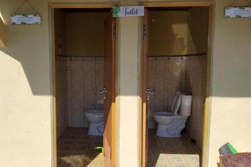 a bathroom with two toilets in a house at Villa Zoya 1 in Bogor