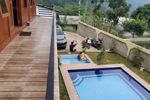 a small swimming pool on the side of a house at Villa Zoya 1 in Bogor