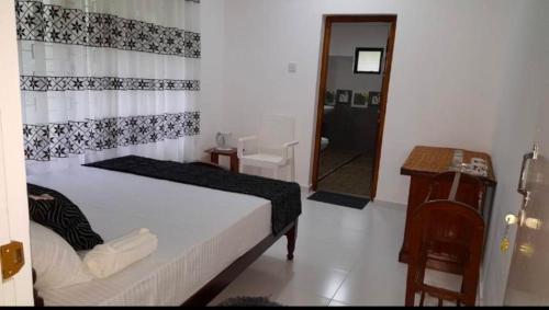 Un ou plusieurs lits dans un hébergement de l'établissement Southern Breeze Homestay Weligama
