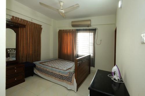 Ένα ή περισσότερα κρεβάτια σε δωμάτιο στο 'Uttara Oasis' Luxury Apartment