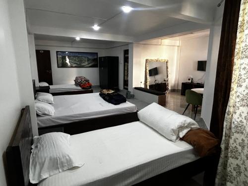 Ένα ή περισσότερα κρεβάτια σε δωμάτιο στο Tsewangs Bed & Breakfast Homestay
