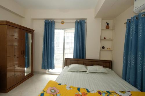 En eller flere senge i et værelse på Bashundhara Breeze