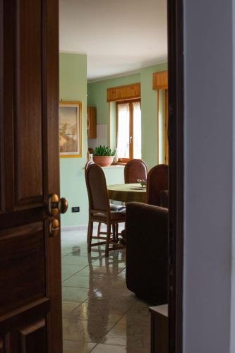 a dining room with a table and chairs at RiHome La Dimora del Rione Serra in Rogliano