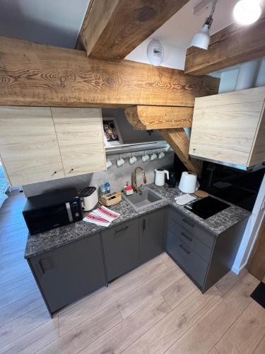 an overhead view of a kitchen with wooden ceilings at Apartament Centro 10 in Leszno