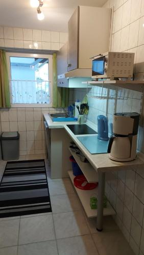 Η κουζίνα ή μικρή κουζίνα στο Ferienwohnung am kleinen Bärenstein 01796 Struppen OT Thürmsdorf Thürmsdorfer Str 28