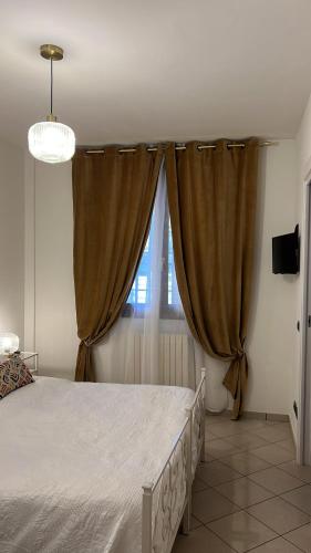 a bedroom with a large bed and a window at Boutique Hotel San Giovanni in San Giovanni in Persiceto