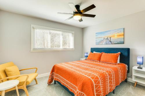 a bedroom with a bed and a ceiling fan at Conveniently Located North Charleston Home! in Charleston