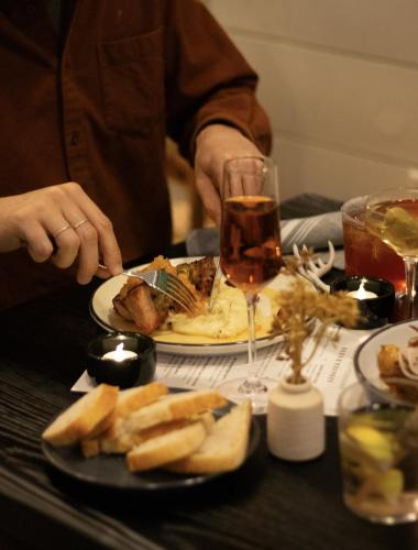 a person sitting at a table with a plate of food at Hotel Cashiers in Cashiers