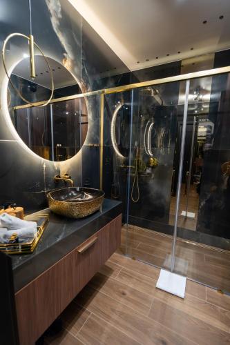 a bathroom with a sink and a shower at Apartament z jacuzzi, Wiślane Tarasy in Krakow