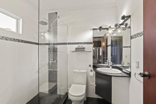 a bathroom with a toilet and a sink at Villa Panlefi - Marbella Estate in Jan Thiel