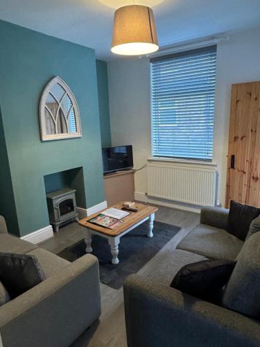 a living room with a couch and a coffee table at Country File in York