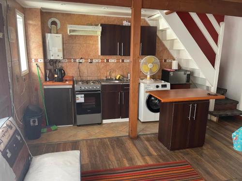 Η κουζίνα ή μικρή κουζίνα στο Cabañas Suecia