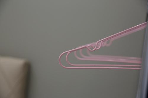 a close up of a refrigerator door with a pink handle at #2 Ioanna Apartments in Thessaloniki