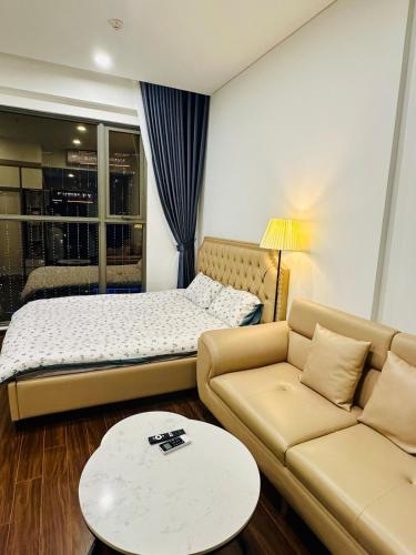 Ένα ή περισσότερα κρεβάτια σε δωμάτιο στο M1T24 Studio toà Masterise