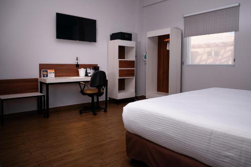 Ένα ή περισσότερα κρεβάτια σε δωμάτιο στο Comfort Inn & Suites Los Cabos