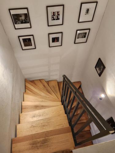 a staircase in a house with pictures on the wall at Grafschaft in Jüterbog