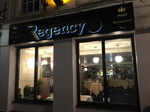 a restaurant with a sign on the front of it at The Kings Head Hotel in Abergavenny