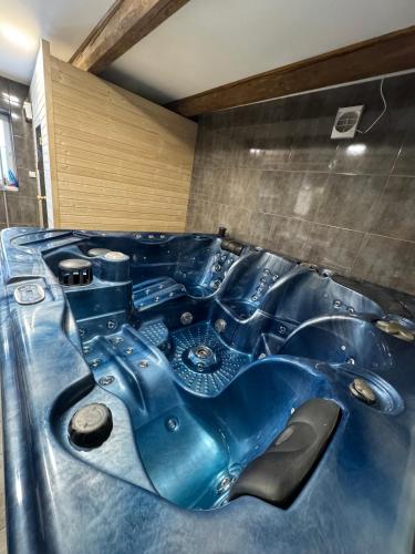a blue bathtub in a room with at Chalupa Kadov in Sněžné