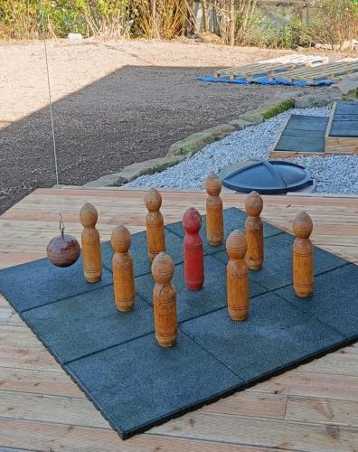 a group of wooden chess pieces sitting on a rug at Ubytování Na potoce in Radvanice