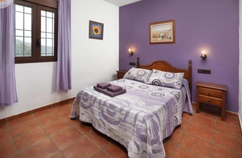 En eller flere senge i et værelse på Casa Rural Los Hidalgos