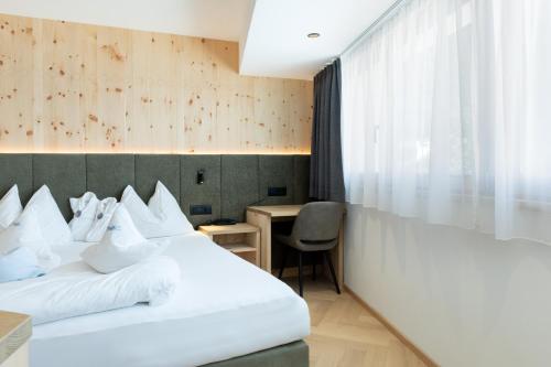 Mountain Hotel Mezdìにあるベッド
