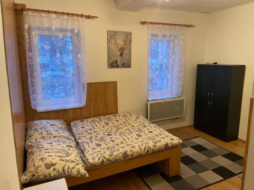 Postel nebo postele na pokoji v ubytování Horský apartmán