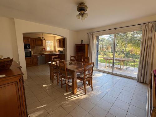 a kitchen and dining room with a table and chairs at Villa provençale dans le Golfe de Saint Tropez in Grimaud