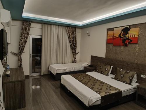 Postel nebo postele na pokoji v ubytování Truva Life Hotel