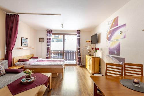 TV a/nebo společenská místnost v ubytování Malino Resort & Residences - Fatrapark 2 Apartments