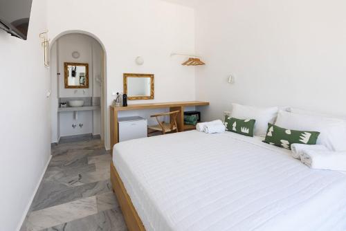 Postel nebo postele na pokoji v ubytování Vounali Rooms