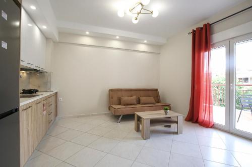 a living room with a couch and a table at #Ioannas Νikopolis Apartments in Thessaloniki