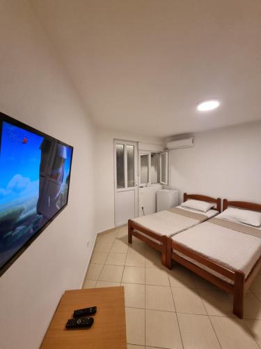 Postel nebo postele na pokoji v ubytování Apartman-Studio Matanović- Save Kovačevića