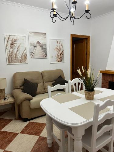 a living room with a couch and a table at Casas PARAJE NATURAL in Zahara de la Sierra