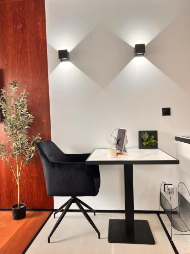 an office with a desk and a chair at PAUL - Confortable studio - design et raffiné in Saint-Étienne