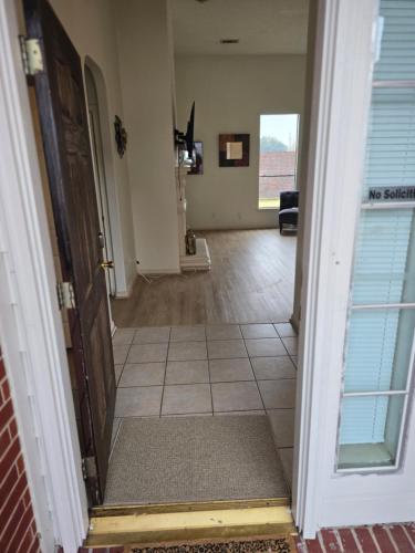 an open door to a room with a hallway at Fresh Crash Pads 4 in Houston
