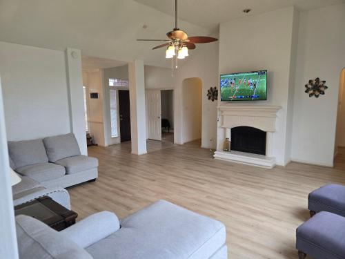 a living room with a couch and a fireplace at Fresh Crash Pads 4 in Houston