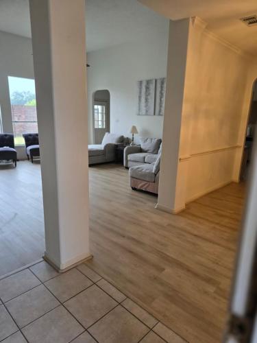 a living room with a couch and a table at Fresh Crash Pads 4 in Houston