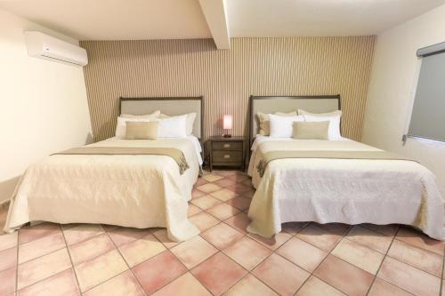 Ένα ή περισσότερα κρεβάτια σε δωμάτιο στο Hotel Posada Terranova