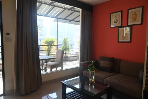 Χώρος καθιστικού στο Boss Suites Nana Hotel