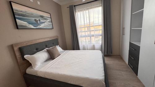 Кровать или кровати в номере 2br master en-suite in Vipingo, Kilifi