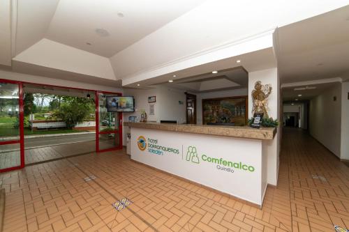 a lobby of a hospital with a reception counter at Hotel Barranqueros Soledén in Armenia