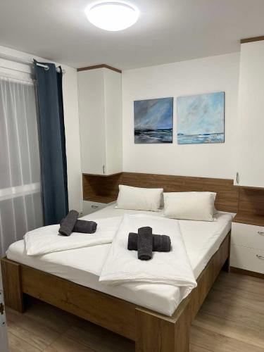 Postel nebo postele na pokoji v ubytování Felicia Apartman