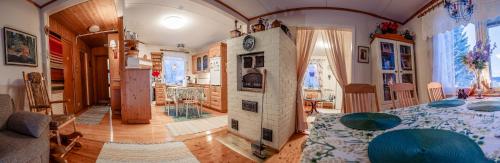 a large living room with a fireplace and a living room at Villa Blue in Autti