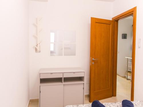 a room with a desk and a wooden door at Villa Callao Salvaje 3 BR Heated Pool & Stunning Views in Adeje