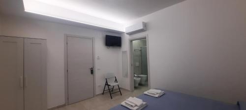 Ένα ή περισσότερα κρεβάτια σε δωμάτιο στο Ninfa Bed and Breakfast