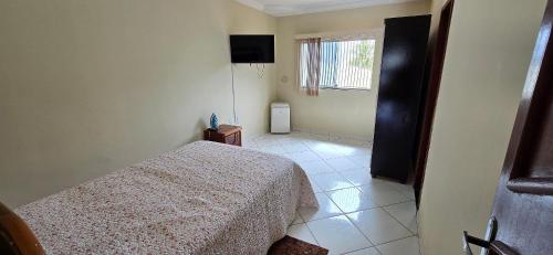 Katil atau katil-katil dalam bilik di Casa Temporada Ilha Bella