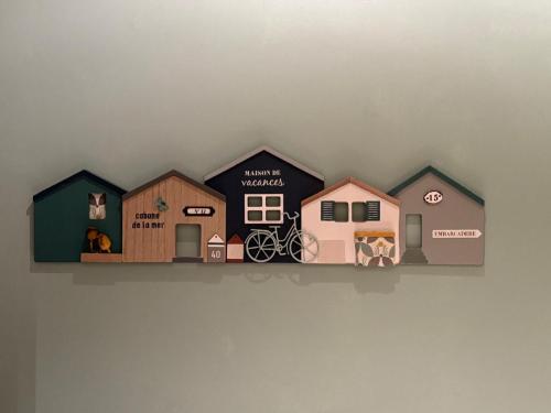a shelf with a bunch of houses on it at Sea and Settle Vakantie Studio in Ostend