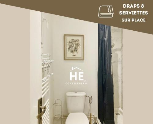 a bathroom with a white toilet in a room at Room 203 Hyper Proche Gare 250m in Montargis